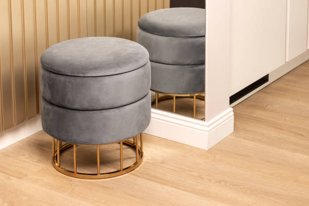 istock Gray pouf in corner of modern hallway 1423985521