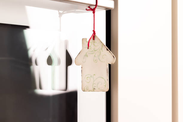 istock Little wooden house on oven 1423985620