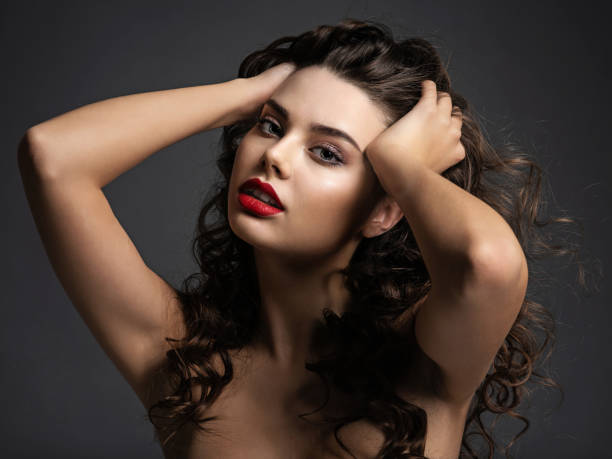 istock beautiful woman with a red lipstick 1423986648