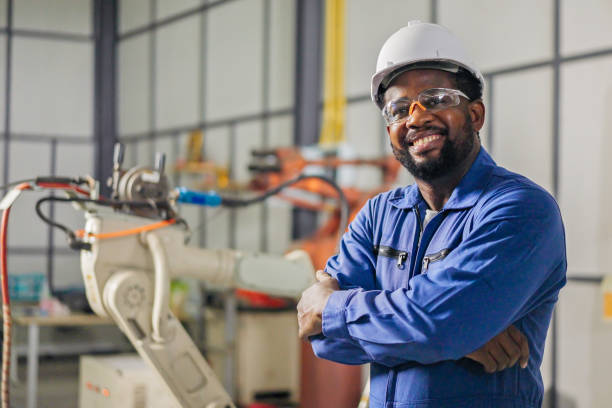 istock Professional Engineer African-American smiles and looking at camera 1423989775