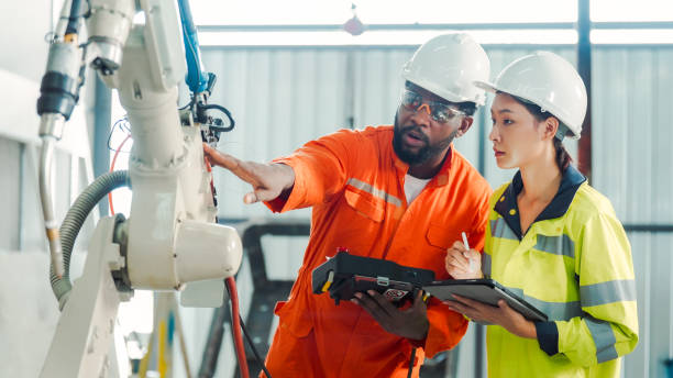 Diversity Professional Engineer training and discussing in Robot Development Plant stock photo