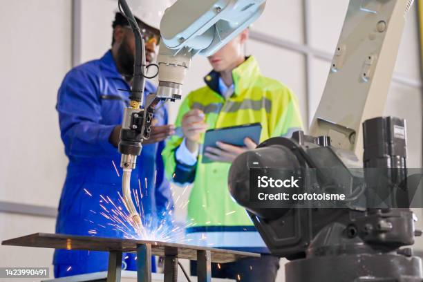 Robotics Engineer Working In Automated Manufacturing Automatic Welding Torch Development Stock Photo - Download Image Now