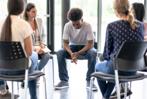 istock Young adults meet for emotional support 1423992613