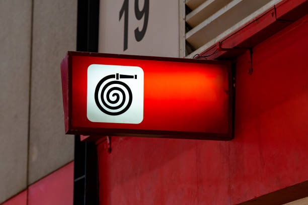 istock A fire equipment sign installed on a wall. Red light on to be noticeable in an exhibition hall that contains many participants. 1423995241