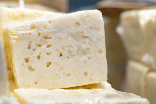 istock Piece of cheese on display in supermarket 1423997472