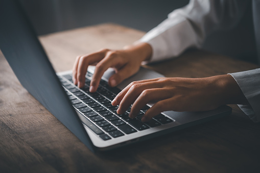 Woman hands typing on laptop keyboard closeup ,  student girl using laptop at home, online learning, internet marketing, working from home, office workplace freelance concept