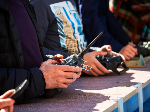 istock The hands of a man with a remote control. 1423997592