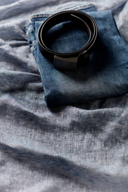istock Jeans trousers on blue background. Copy space. 1424000067