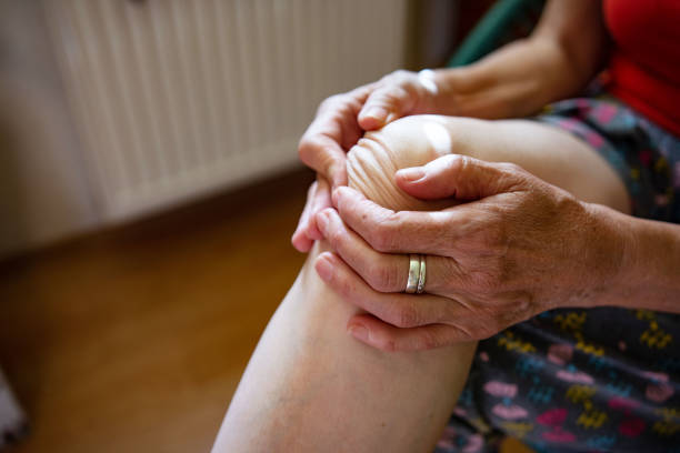 istock Unrecognizable woman suffering from knee pain 1424001695