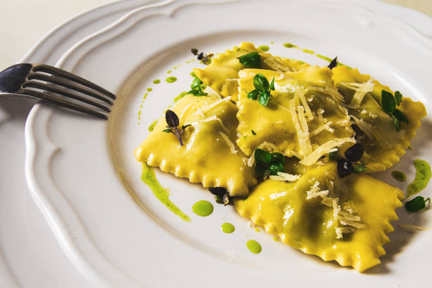 istock Ravioli with spinach and cheese, green sauce, on a light background, selective focus, no people, 1424001758