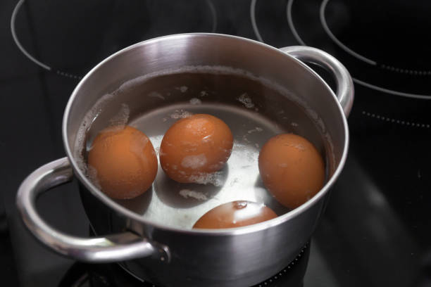 istock Eggs in stainless steel pan cooking with water 1424004259