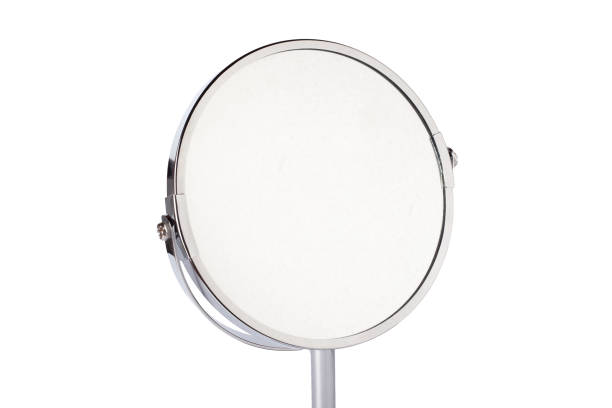 istock Desktop make up cosmetic mirror isolated on white background. Home metal mirror close up isolated. Facial mirror. 1424004340