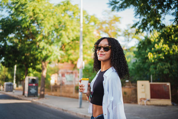 istock Young woman having a coffee 1424004507