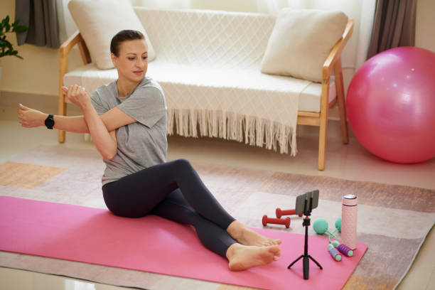 istock Woman Stretching Arms 1424006140
