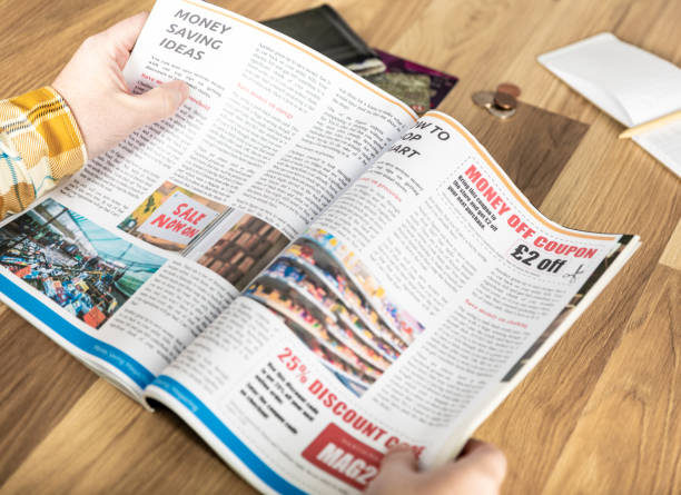 istock Money saving discount coupons in a magazine 1424007047