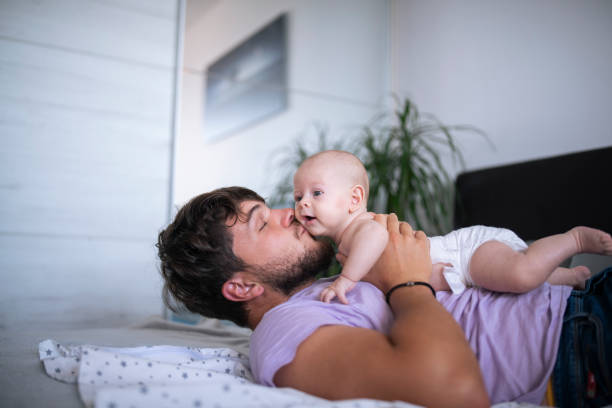 istock Happy dad kissing his little one. 1424008227