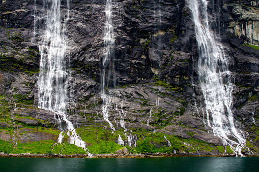 Geirangerfjord near Hellesylt in Norway.  This is the famous seven sisters waterfall one of the highest in Norway.