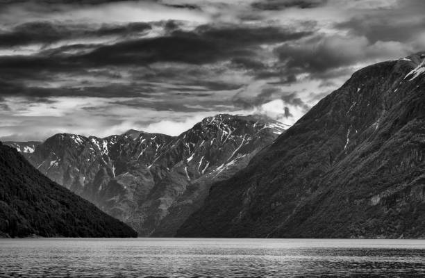 istock Snow capped mountains above Hellesylt in Norway. 1424012428