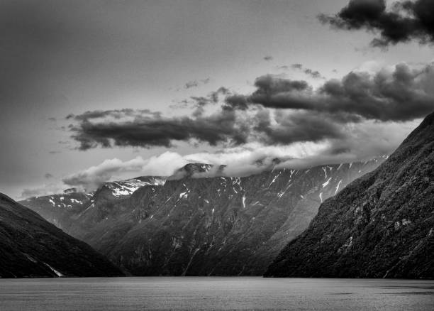 istock Snow capped mountains above Hellesylt in Norway. 1424012930