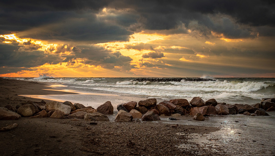 A heavenly sunset on Presque Isle in Erie, Pennsylvania. Rays of light burst through the clouds shortly after a storm.