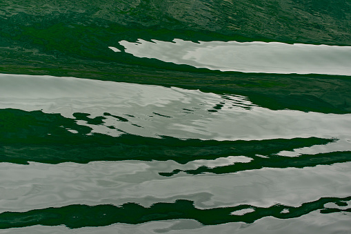 Geirangerfjord near Hellesylt in Norway.  This is the wake from a cruise ship on the Fjord.