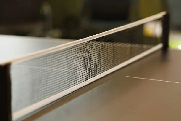 Photo of the table tennis net is stretched on the gaming table