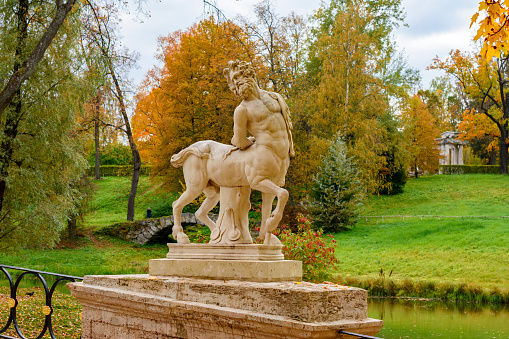 Saint Petersburg, Russia - October 2021: Centaur bridge statue in Pavlovsky park in autumn