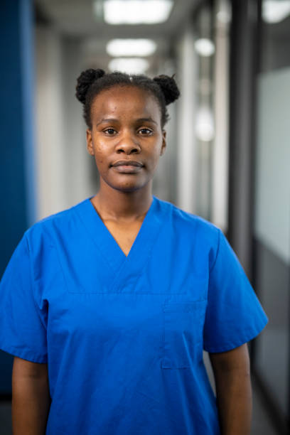 istock Portrait confident African nurse in corridor 1424022455