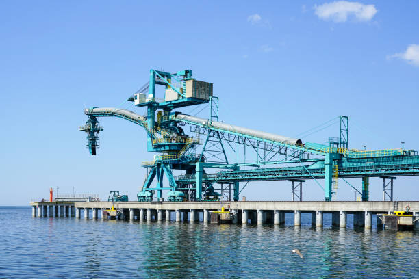 istock Equipment for loading coal into a ship in a modern closed type coal terminal 1424024822