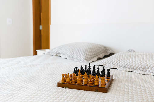 Chess table detail on bed.