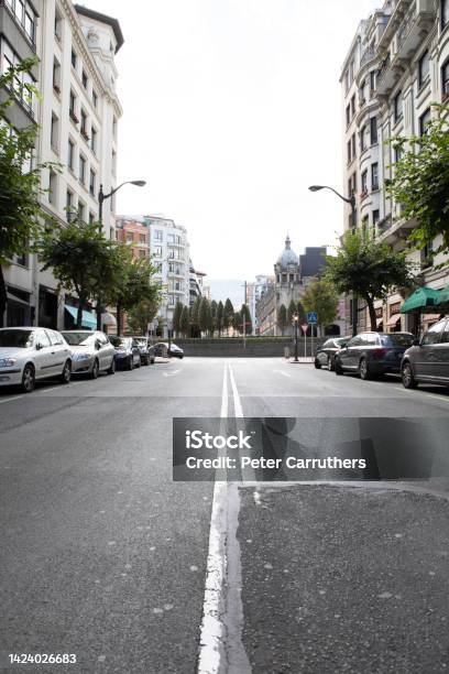 Quiet Spanish City Backstreet Viewed From The Centre Of The Road Stock Photo - Download Image Now