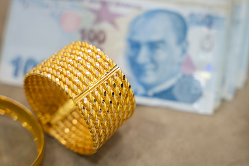 Turkish lira and gold bracelet
