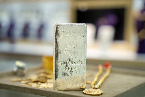 silver coins and silver bullion . Banking and finance concept precious metals