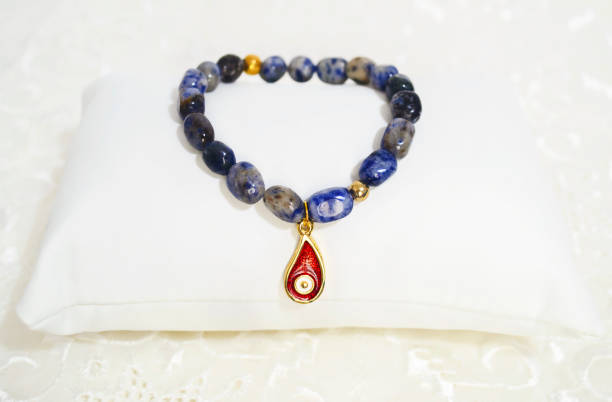 gemstone bracelet - lapis lazuli with evil eye stock photo