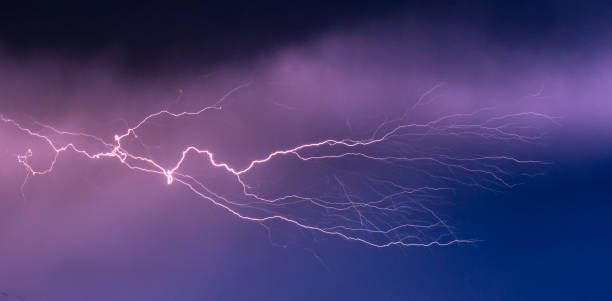 istock Strongly branched lightning bolt high up in the sky 1424034376