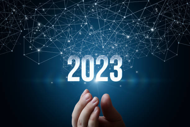 Hand shows new year 2023 appearing from the network . stock photo