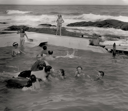 Accra, Ghana - 1958: People swimming in a saltwater pool on the coast at Teshie in Accra, Ghana c.1958