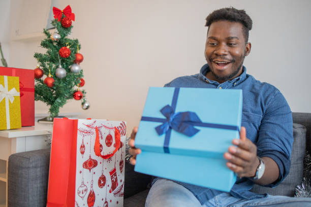 istock Man celebrating Christmas Eve at home 1424042782
