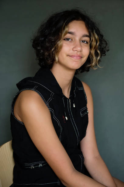 istock Portrait of a mixed-race non-binary teenager in studio. 1424045545
