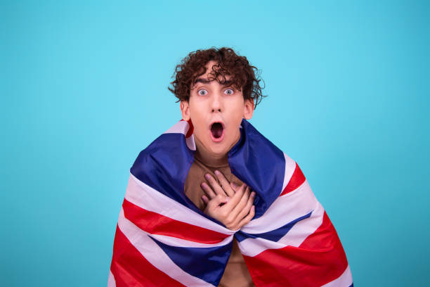 istock Young attractive guy with a flag posing in the studio. 1424046753
