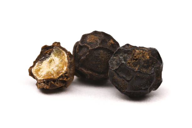 istock Closeup of black peppercorns 1424047480
