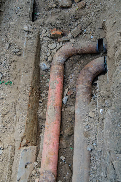 istock Old leaky pipes in the pit. Preparation for pipe replacement 1424049015