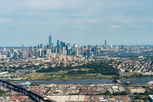 8/14/2022:  Manhattan, New York, USA an aerial view of Lower Manhattan, Jersey City, the Pulaski Skyway, Hudson River and the Port of Newark, Hoboken