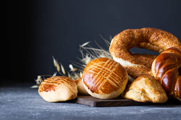 Traditional Turkish pastry concept,  pogaca , bagel,  on rustic table, famous bakery product stock photo