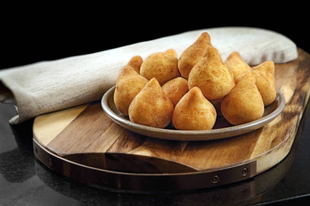 Coxinha de Frango 1 Coxinhas de Frango, classic and delicious snack of Brazilian cuisine coxinha stock pictures, royalty-free photos & images