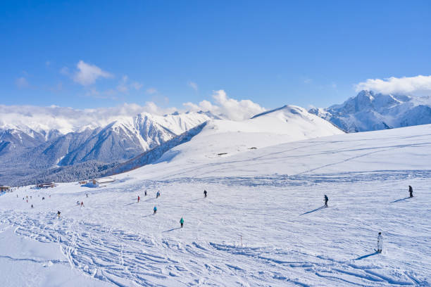istock People on the ski slope on a sunny day 1424050630