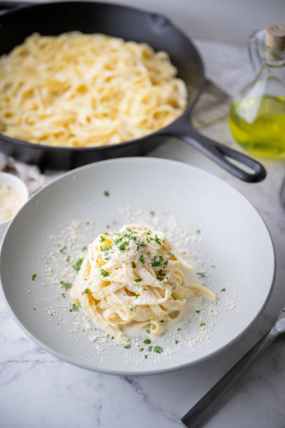 istock fettuccine alfredo, traditional cream cheese pasta 1424050755
