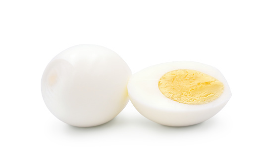 Hard boiled peeled egg whole and half isolated on white background