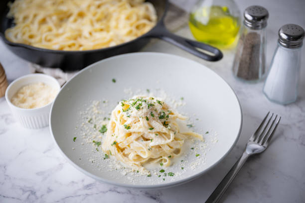istock fettuccine alfredo, traditional cream cheese pasta 1424051242