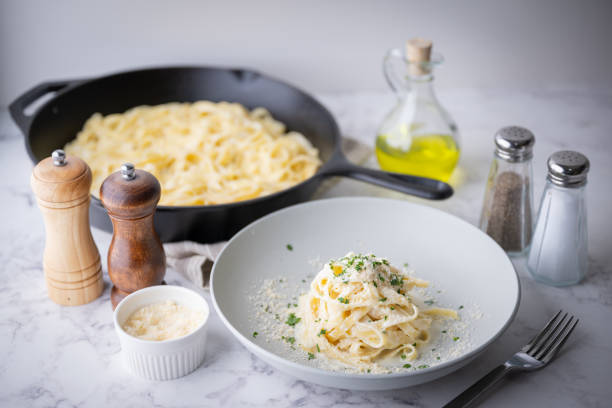 istock fettuccine alfredo, traditional cream cheese pasta 1424051579